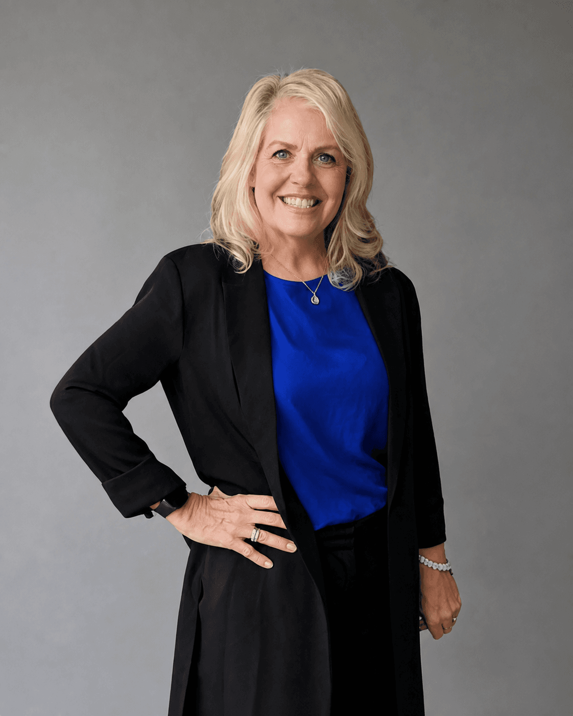Lisa A. Morrison, author of When the Story Changes, in a royal-blue blouse and black blazer